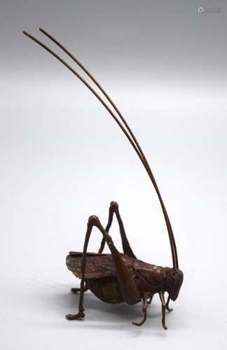 A Japanese bronze cricket 4 cm.