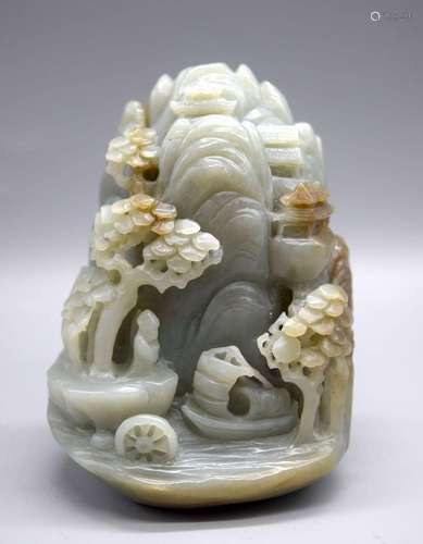 A Chinese carved Jade boulder depicting a lake and mountains...