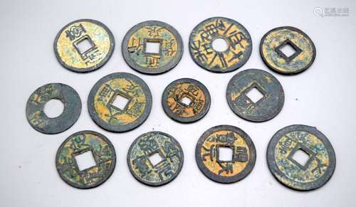 A collection of Chinese metal tokens (12).