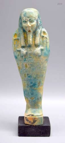 A glazed pottery figure of an Egyptian Pharoah 16 cm.