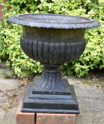 A COUNTRY HOUSE CAST IRON PEDESTAL GARDEN URN. 52 cm x 54 cm...