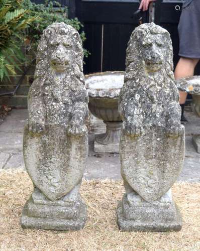 A CHARMING PAIR OF COUNTRY HOUSE CARVED GARDEN STONE LIONS m...