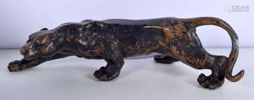 A Cold painted bronze leopard 10 x 36 cm.