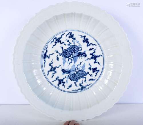 A large porcelain blue and white dish decorated with a beast...