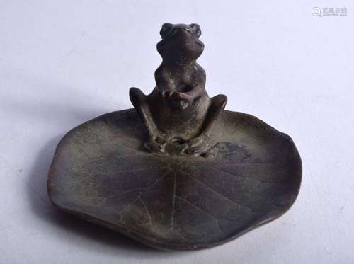 A Japanese bronze frog on a lily pad 4.5 x 8 cm.