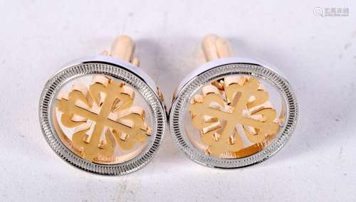 A pair of gilt metal cufflinks .