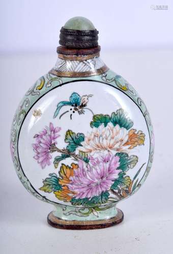 A Chinese enamelled metal snuff bottle decorated with flower...