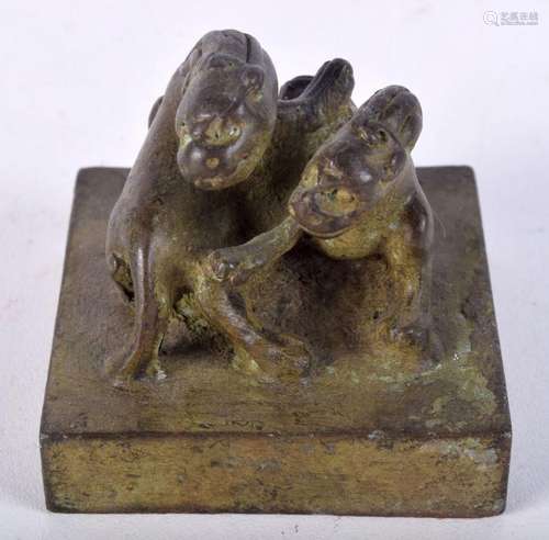 A Chinese bronze seal in the form of beasts 5 x 5.5 cm.