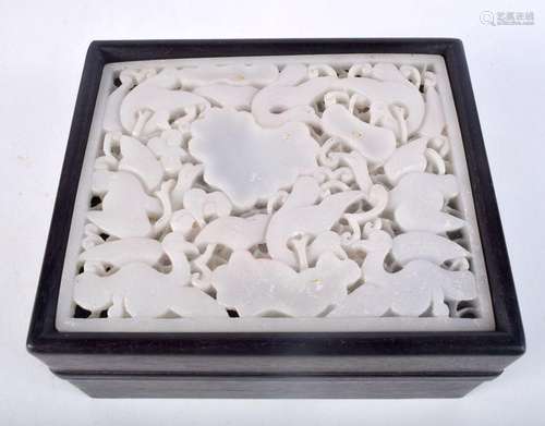 A Chinese hardwood lidded box with a carved Jade panel of bi...