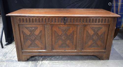 An 18/19th Century oak Coffer with carved panel to the front...