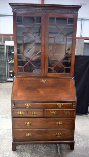 A large veneered bureau bookcase with glass fronted doors an...