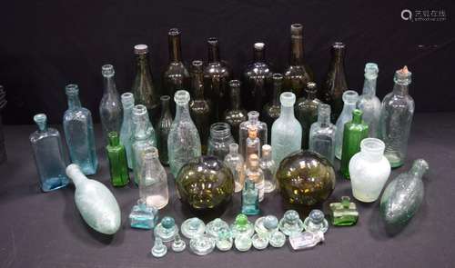 A collection of vintage/antique beverage bottles, apothecary...