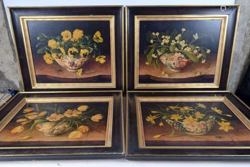 A set of 4 framed oleographs on canvas of flowers in orienta...