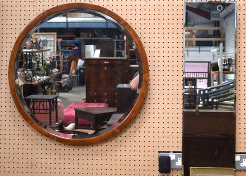 A large wooden framed mirror together with a bevelled rectan...