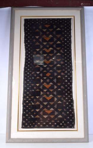 A large framed African Kuba fabric 119 x 57 cm.