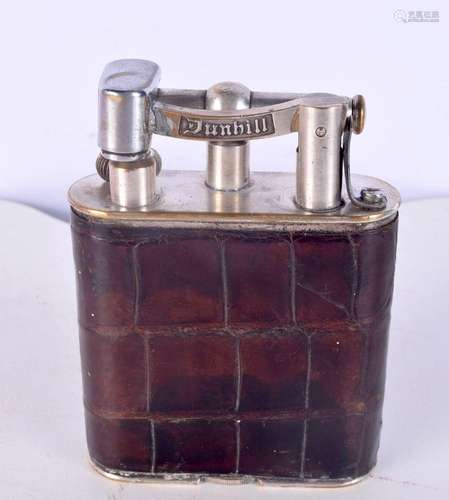 A vintage crocodile skin Dunhill lighter 11 x 8 .5 cm.