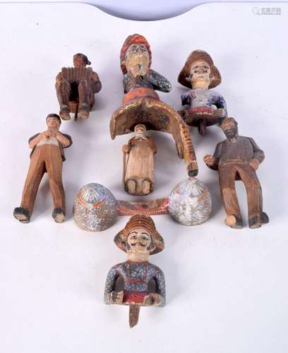 A collection of Middle Eastern wooden figures together with ...