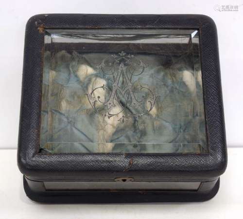 A small antique leather and glass display/jewellery box with...