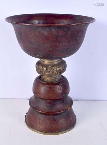 An Indian brass and copper urn