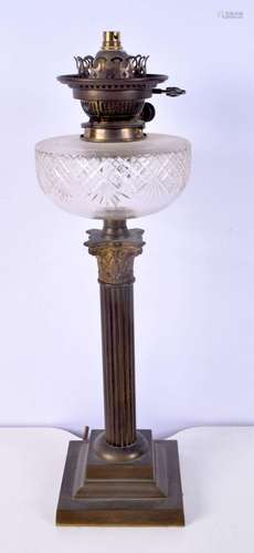 A Victorian brass column and glass oil lamp base 54 cm