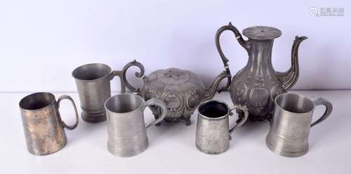 A collection of Pewter items mugs/tea pots largest 24 cm (7)...