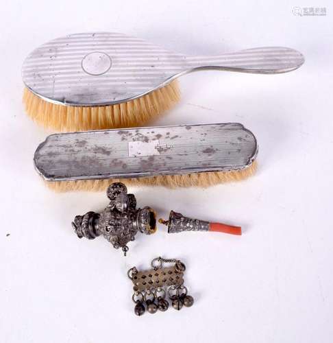 A collection of silver items, brushes , babies rattle etc la...