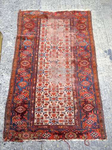 A red ground Caucasian rug 179 x 100 cm