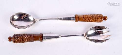 A pair of carved wood handled WMF serving spoons 26 cm (2)