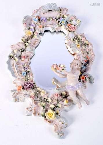 A Continental flower encrusted porcelain mirror 48 x 28 cm