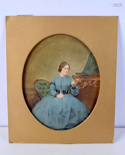 An antique coloured photograph of a female 28 x 23 cm .