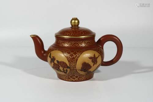 Gold-painted purple clay teapot