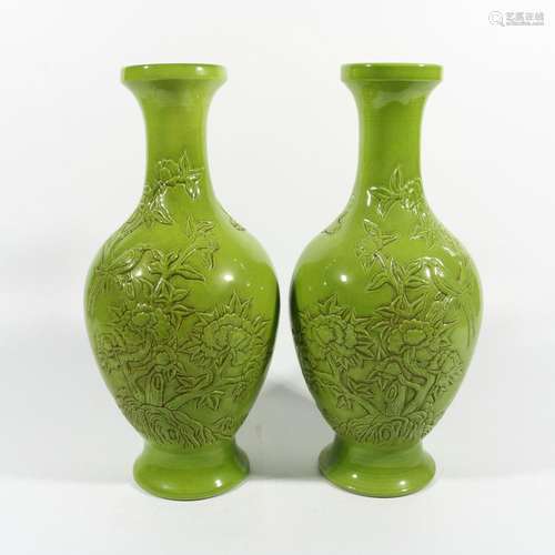 A pair of apple green glazed flower and bird vases