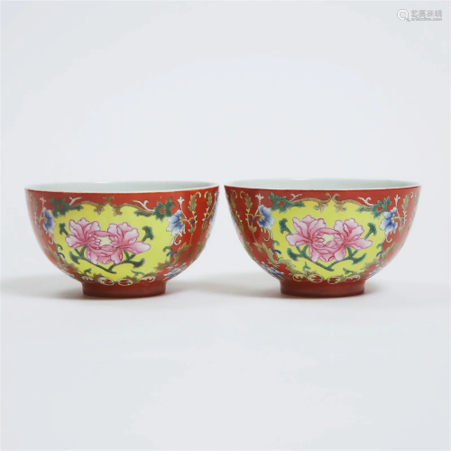 A Pair of Coral Ground Famille Rose 'Floral' Bowls...