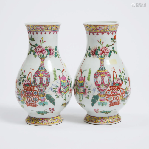 A Pair of Famille Rose 'Hundred Antique' Hu Vases,...