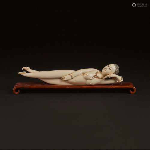 A Large Ivory Figure of a Reclining Lady, 'Medicine/Doc...