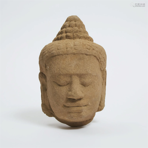 A Khmer Sandstone Head of a Deity, Cambodia, 12th Century o