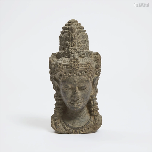 A Volcanic Stone Head of a Deity, Java, 14th Century, heigh