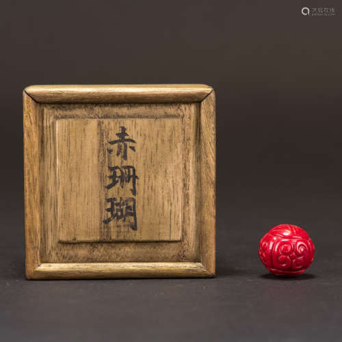 A CORAL BEAD WITH JAPANESE BOX