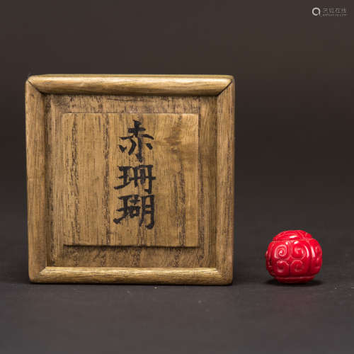 A CORAL BEAD WITH JAPANESE BOX
