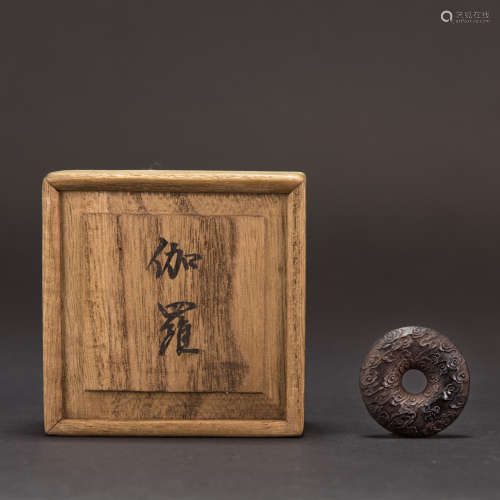 A CARVED CHENXIANG BI DISC WITH JAPANESE BOX
