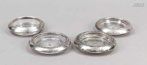 Four coasters with silver rim mount