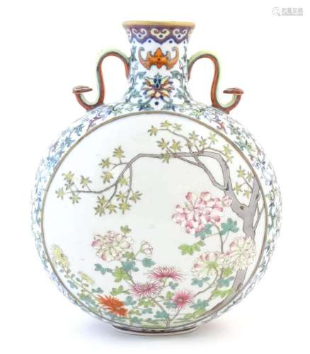 A Chinese famille rose moon vase with twin handles modelled ...