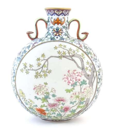 A Chinese famille rose moon vase with twin handles modelled ...