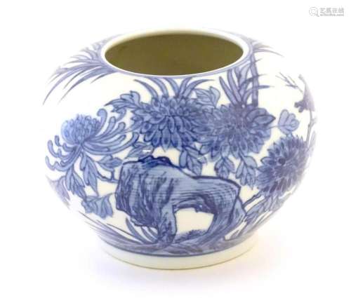 A Chinese blue and white pot decorated with birds, flowers a...