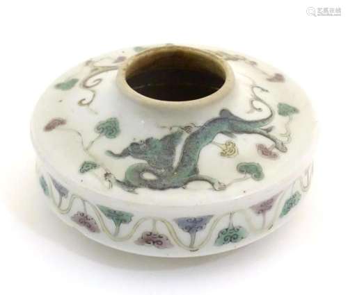 A Chinese brush wash of circular form decorated with dragons...