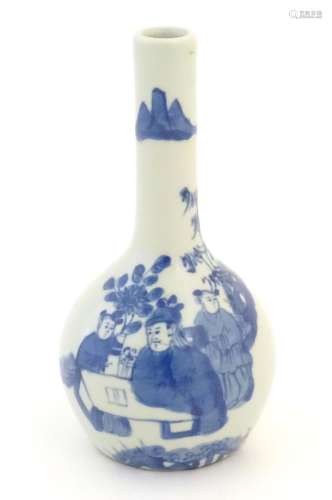 A Chinese blue and white bottle vase decorated with a schola...