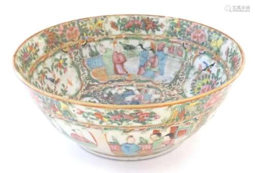 A Cantonese famille rose bowl with panelled decoration depic...