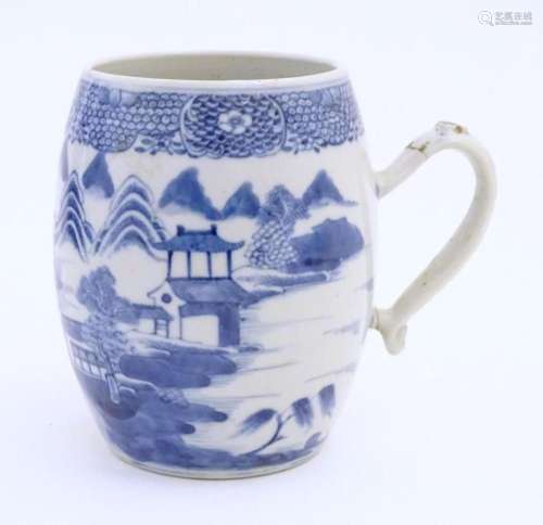A Chinese blue and white export mug of barrel form decorated...