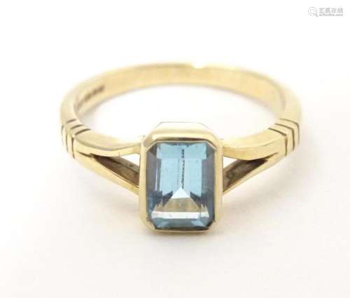 A 9ct gold ring set with aquamarine. Ring size approx L 1/2