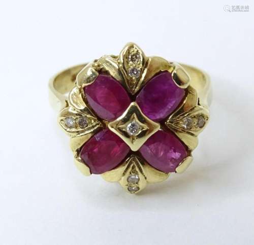 An 18ct gold ring set four ruby coloured spinel and nine dia...